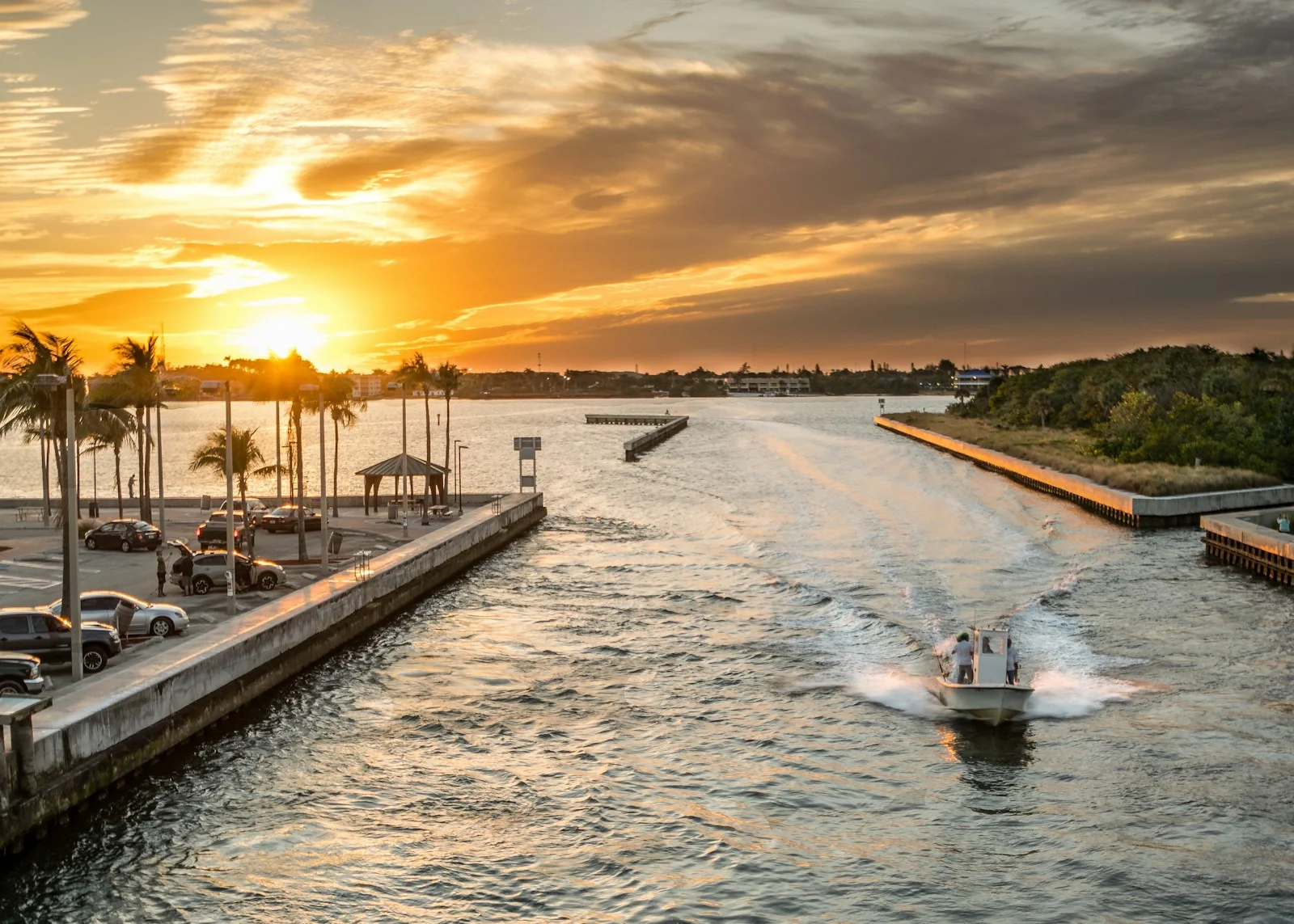 Boats passing through Boynton Inlet at sunset, Palm Beach County