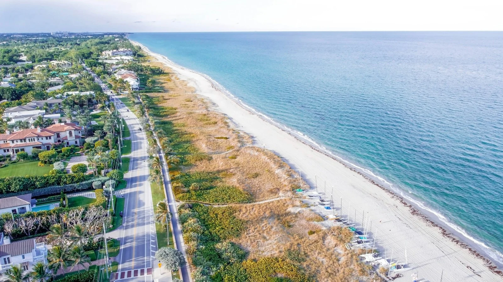 Aerial view of the beach, coastal road and homes in Delray Beach
