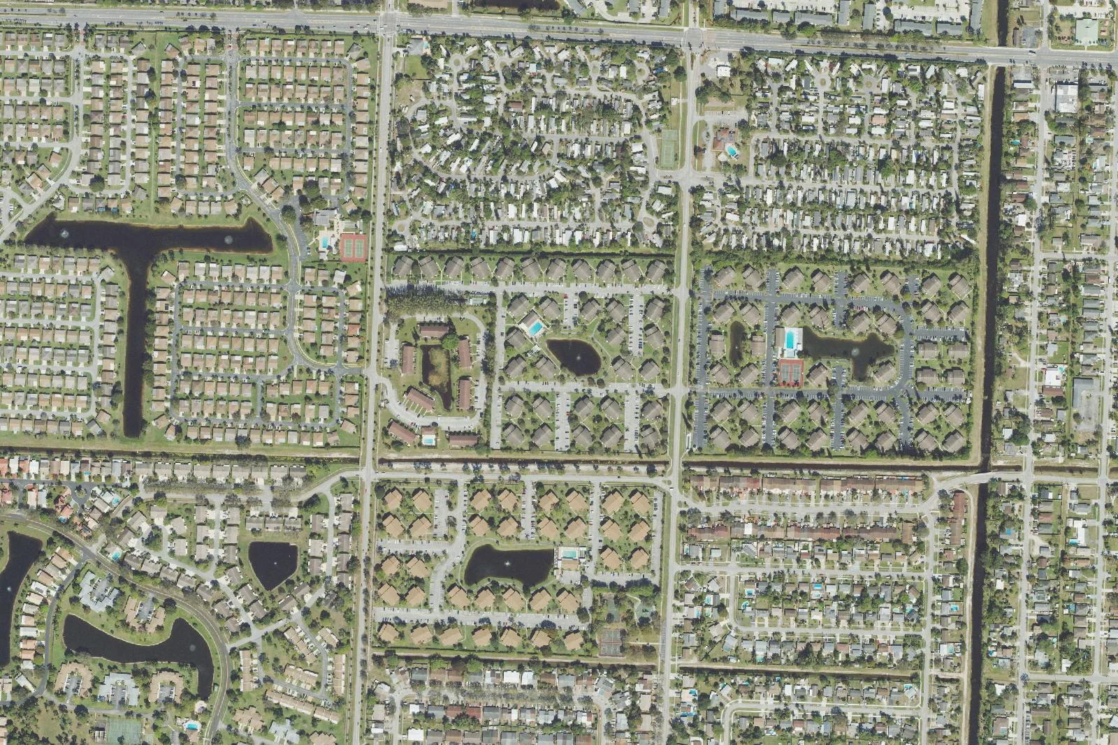 Aerial photograph of residential streets, lakes and green spaces in Greenacres